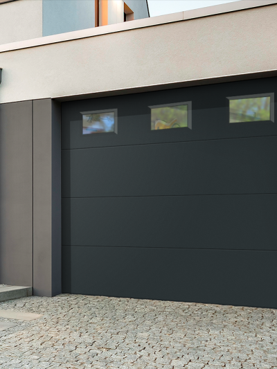 Porte de garage sectionnelle lisse avec hublots Confort - JADE